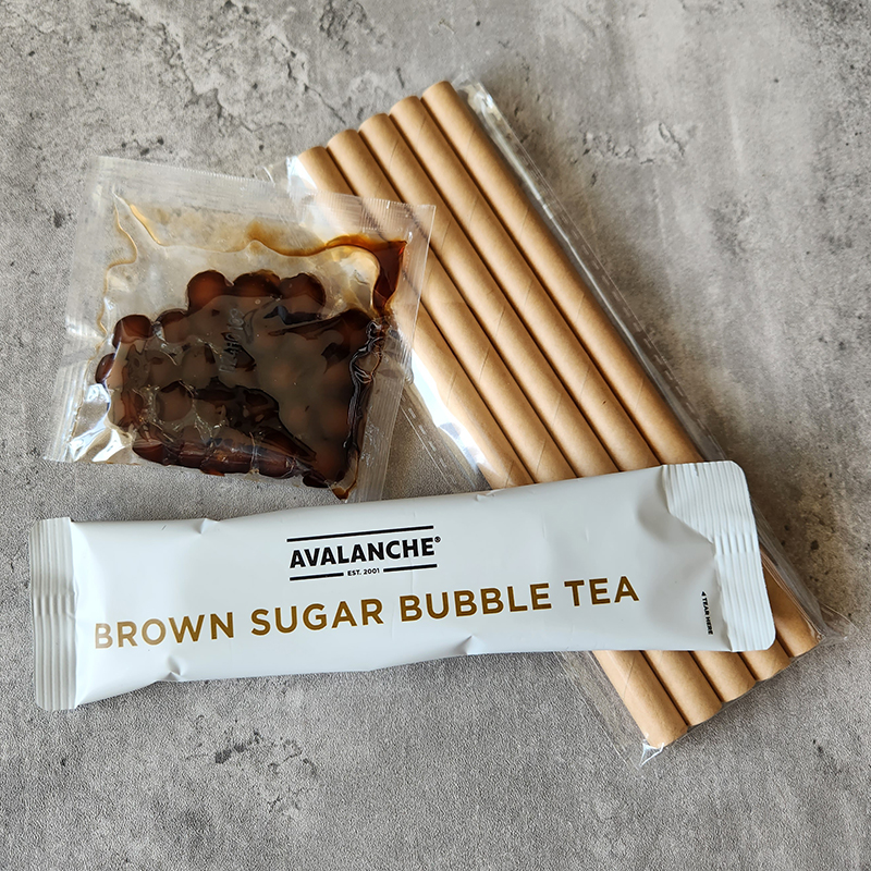 Avalanche kit contents: a sachet of tea mix, a sachet of boba and a packet of straws