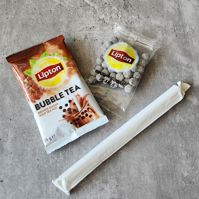 Lipton kit: bubble tea mix, a sachet of boba and a an individually wrapped straw
